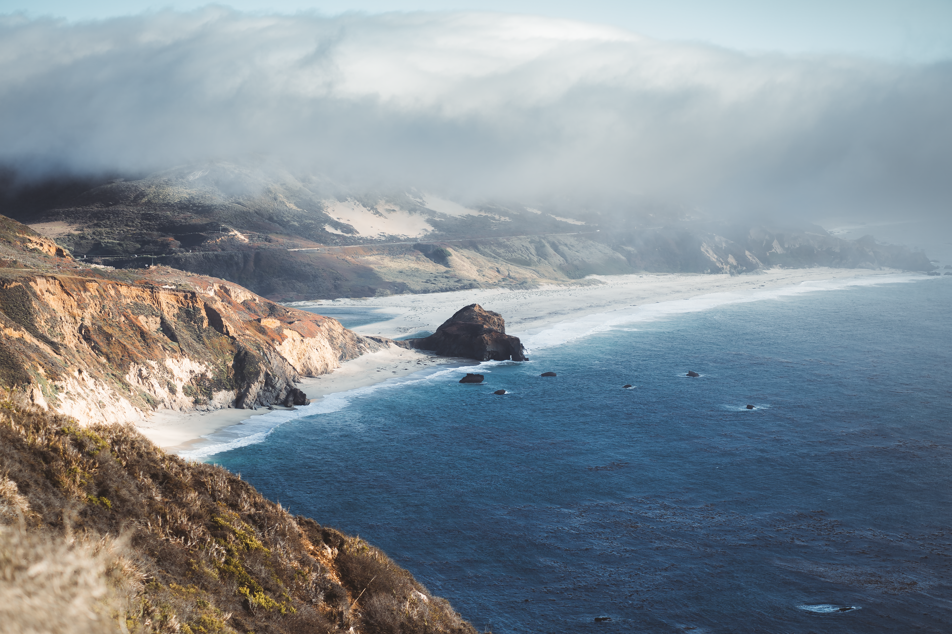 Misty ocean cliffs along California coast
